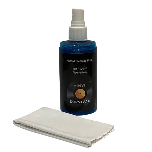 120ml bottle of vinyl survival record cleaning fluid with white cleaning cloth laying in front of it