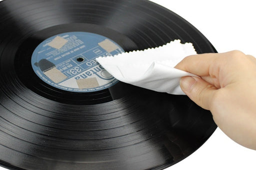 Wiping of  a microfibre cleaning cloth on a album