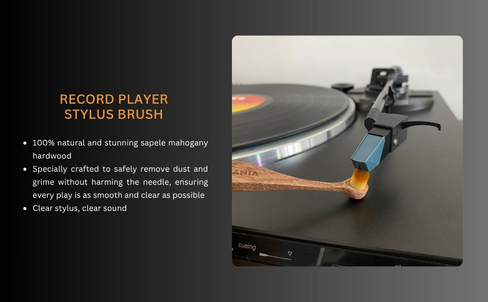 Record player stylus brush with text held by a hand and in act of cleaning a record player stylus