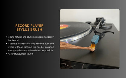 Record player stylus brush with text held by a hand and in act of cleaning a record player stylus