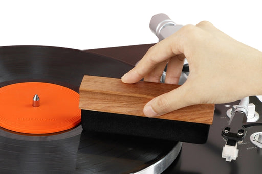 Wiping a record with a vinyl survival soft velvet brush
