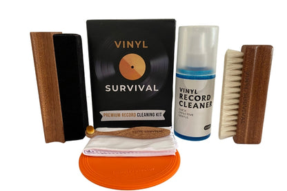 All the contents of the Vinyl Survival record cleaning kit: velvet brush, stylus brush, microfibre cloth, label protector, cleaning fluid, goat hair deep groove cleaning brush