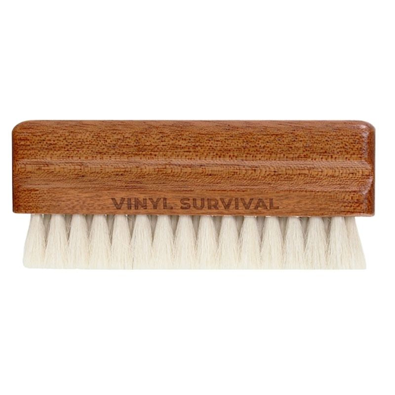 Vinyl Survival natural goat hair record cleaning bristle brush with name etched on brush. Standing horizontal with bristles on bottom